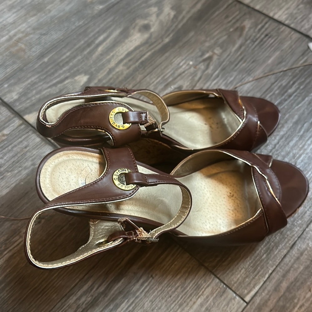 J
Guess, size  7.5 brown leather open toed, cork wedge heel, ankle strap;